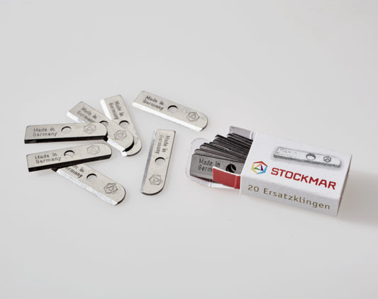 Stockmar Dual Pencil Sharpener Replacement Blades spilling out of it's box on a white background