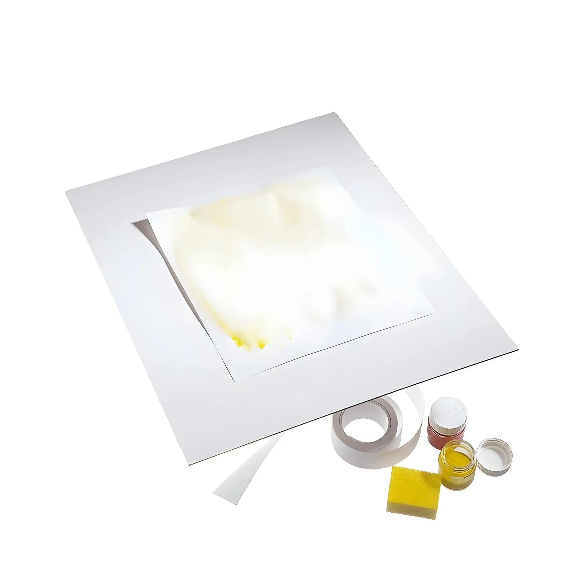 Compostable Painting Board with Watercolor Paper on top next to sponge, tape and jars of watercolors