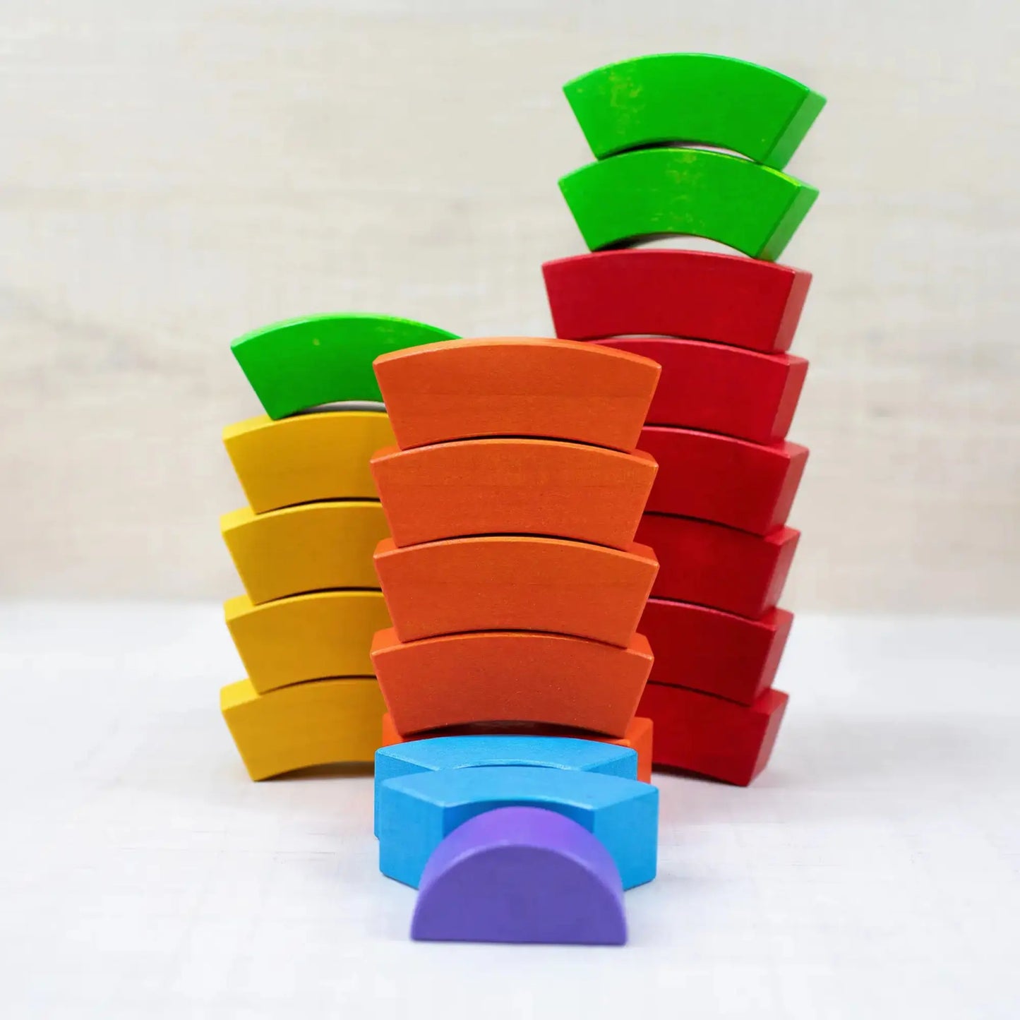 Stack of colorful wooden blocks on a white background