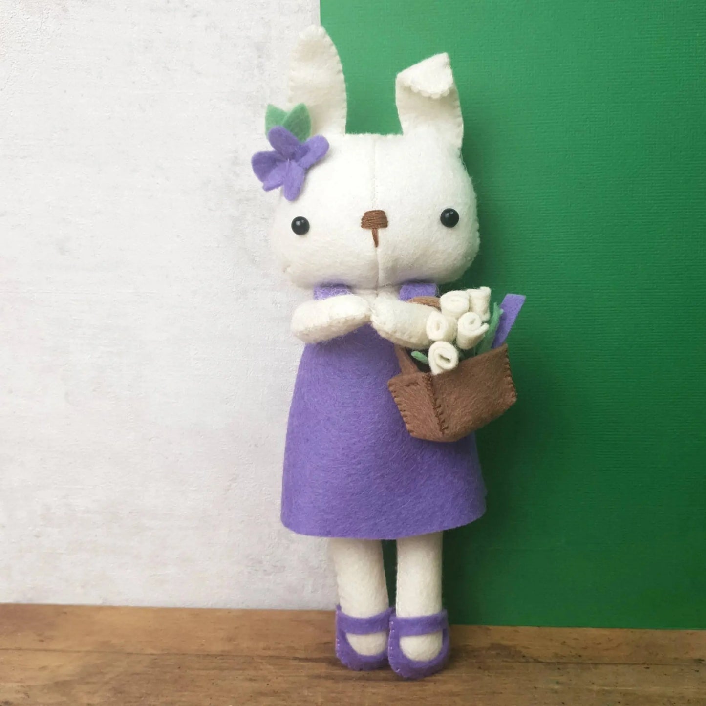 DIY Kit felt bunny in purple dress on tabletop