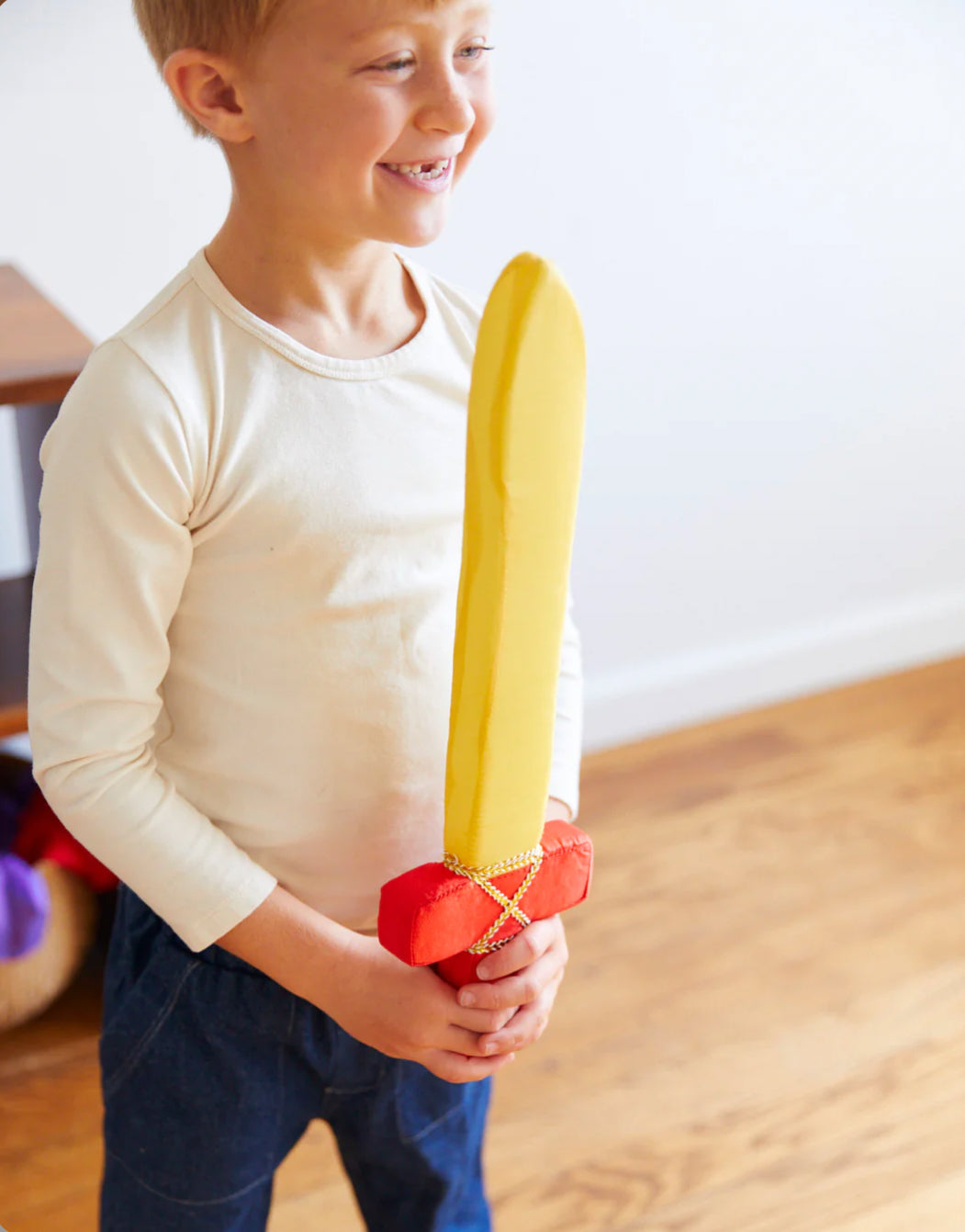 Child playing with a Soft Sword - Silk + Foam