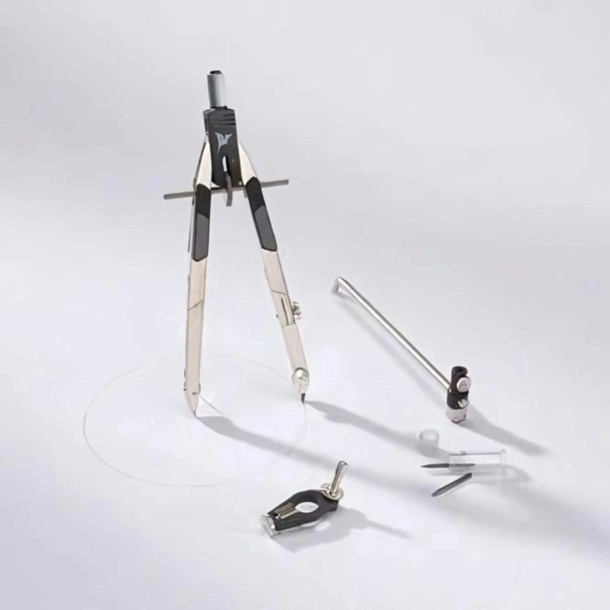 Mechanical drawing compass with arm extension and pencil adapter on a white background