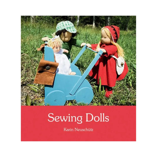 Book cover for Sewing Dolls with a boy and girl doll standing with a wooden doll carriage