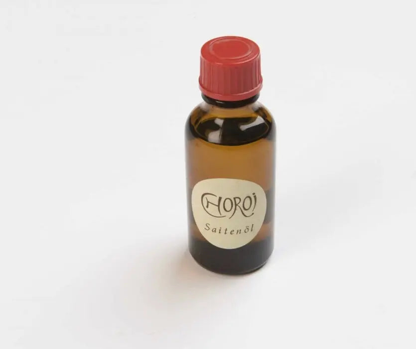 One bottle of String Oil by Choroi on a white background