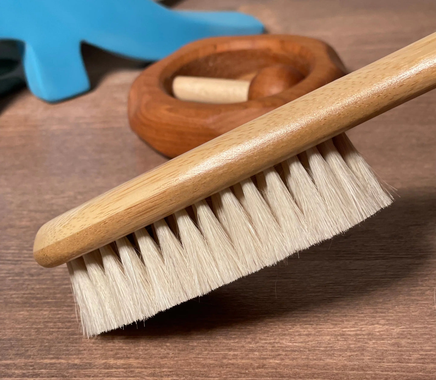 Side view of the natural bristles on the wooden baby brush