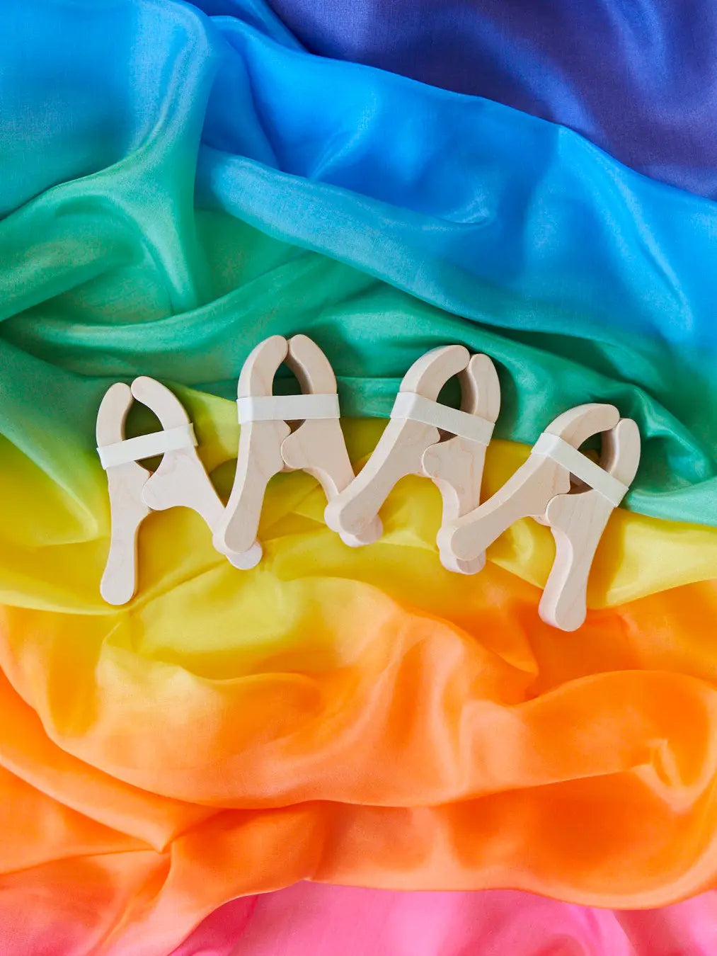 Sarah’s Silks four Playcloth Clips on a rainbow silk