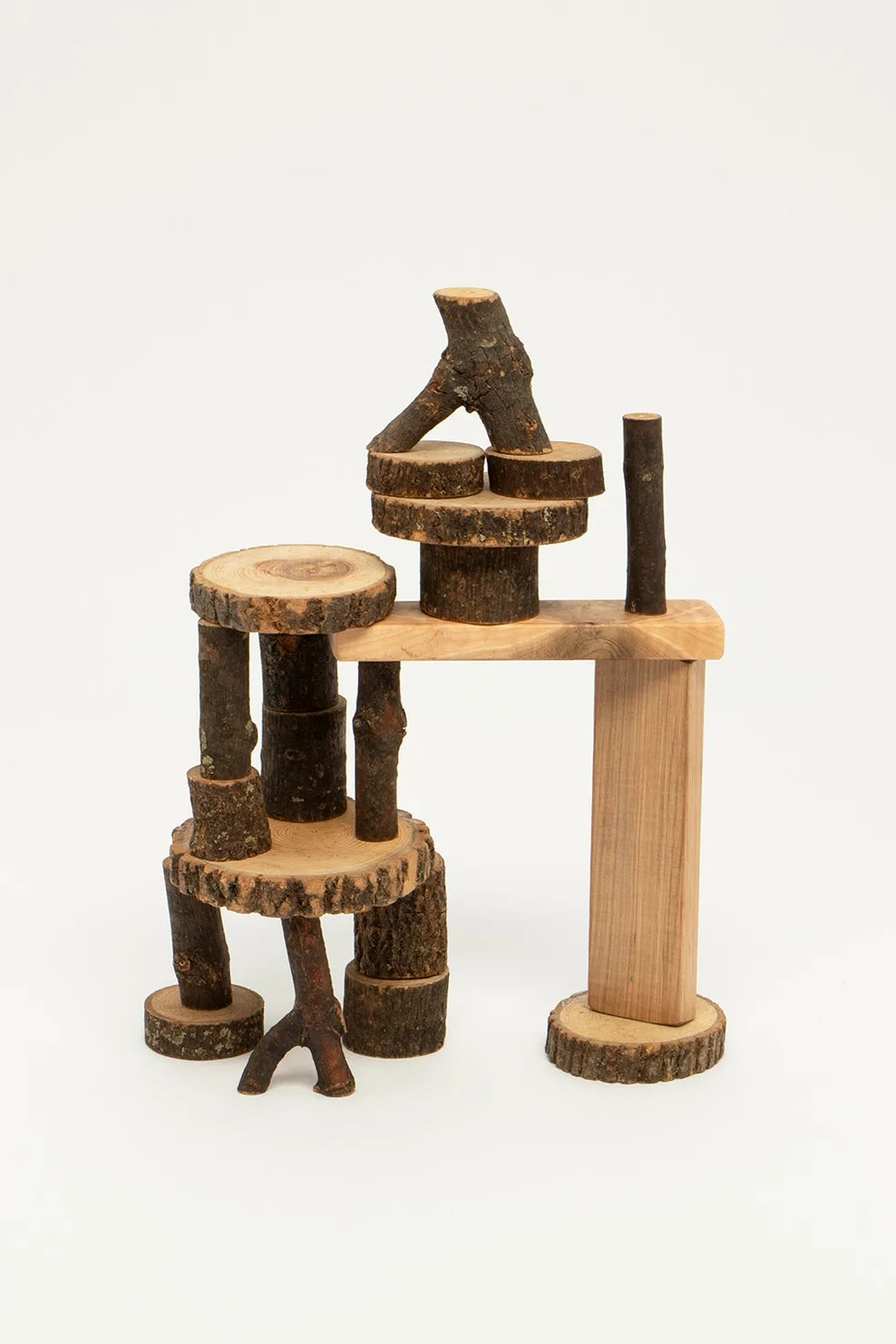 Barked Tree Blocks for open ended play stacked against a white background