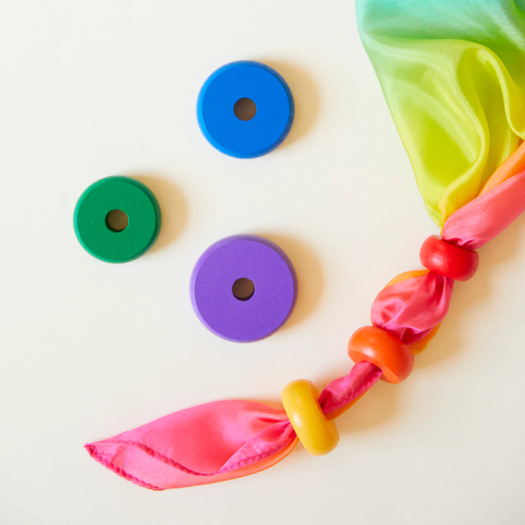 Playsilks used to thread wooden beads