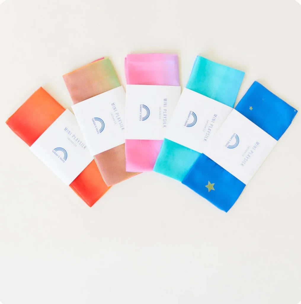 Sarah’s Silks - Enchanted Playsilks arranged in a fanning layout on white background