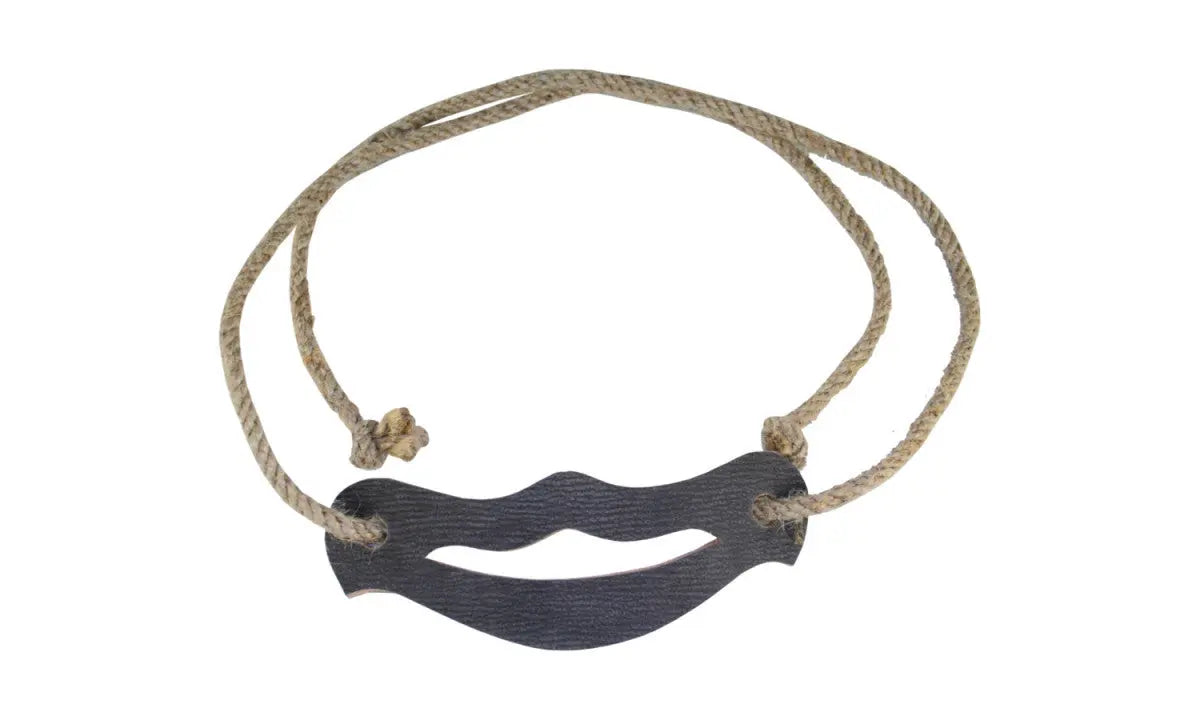 Necklace with a dark blue wave-shaped pendant on a beige cord against a white background