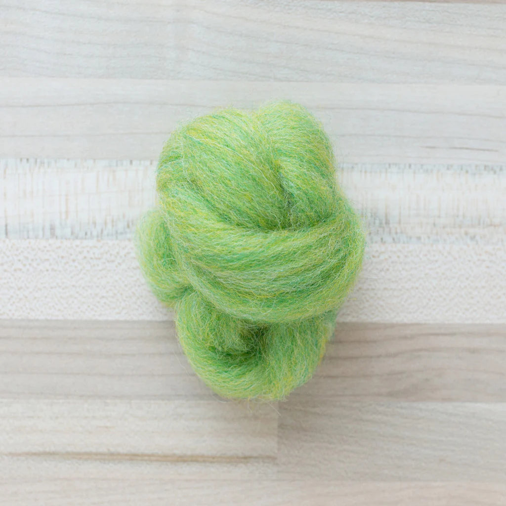 Kiwi Light Green Wool Roving Felter's Flowing on tabletop