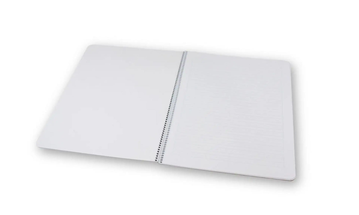 White notebook with a grid pattern on a white background