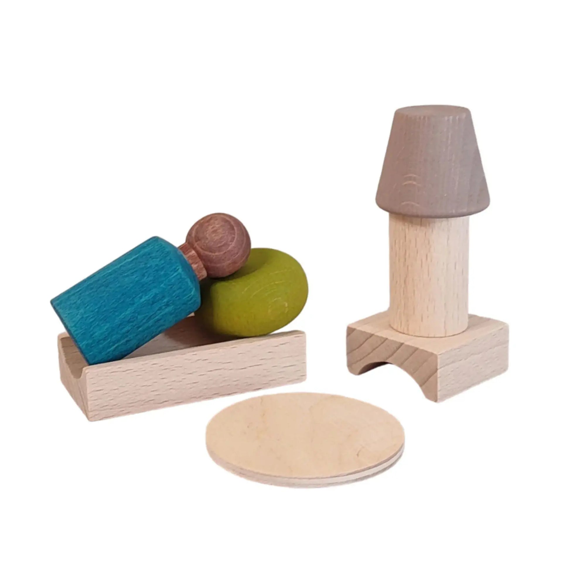 Set of wooden toys including a lamp, blocks, and a tray on a white background
