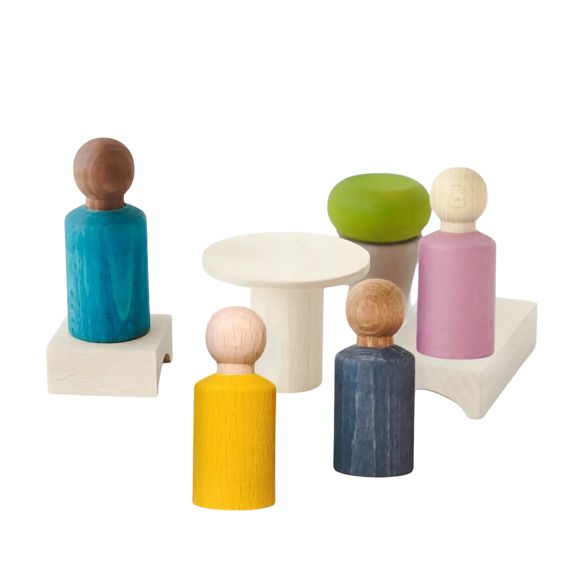 Set of colorful Waldorf style wooden peg dolls on a white background