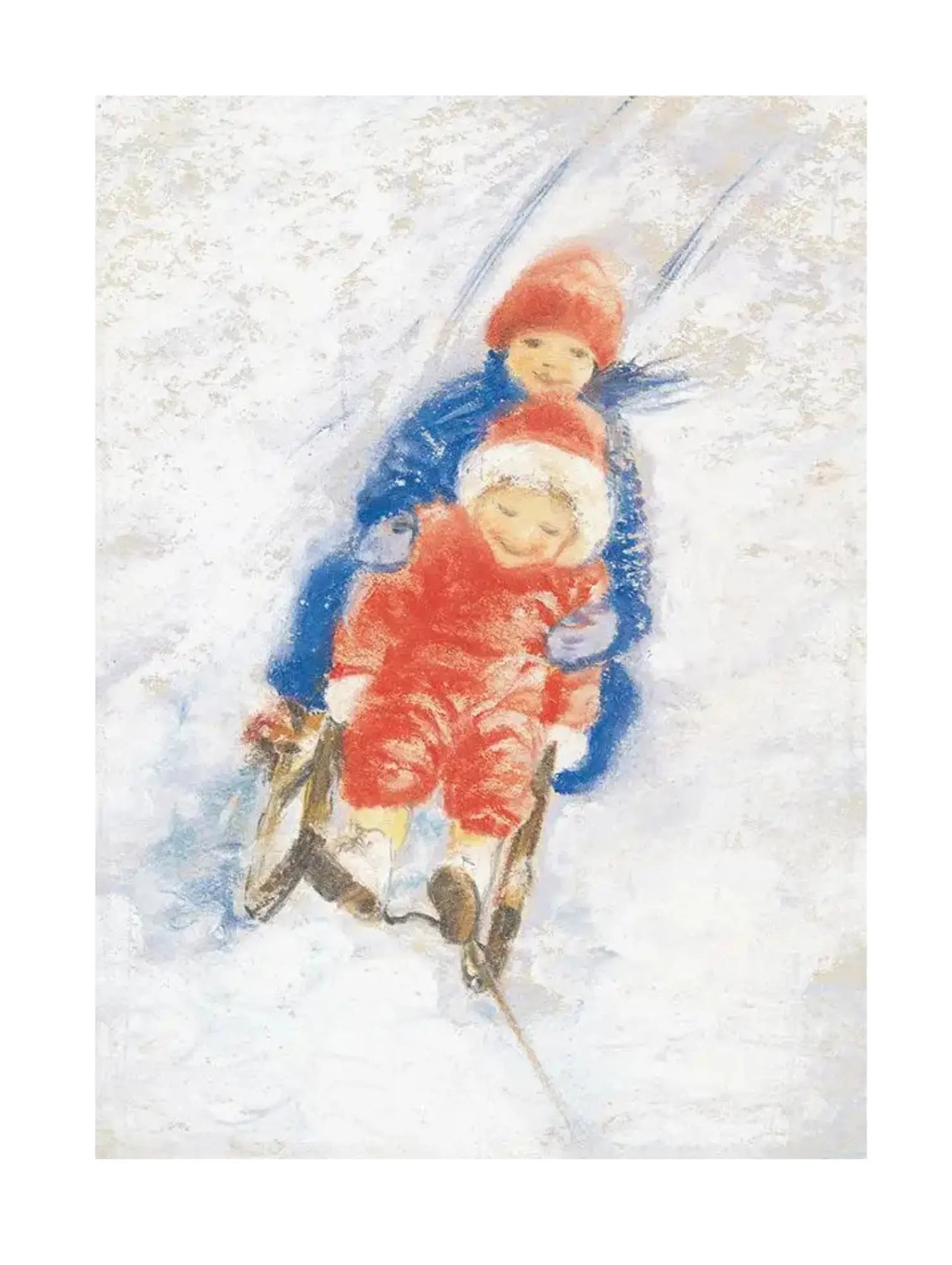 Two children in blue and red snowsuits and hats sledding down a snowy hill.