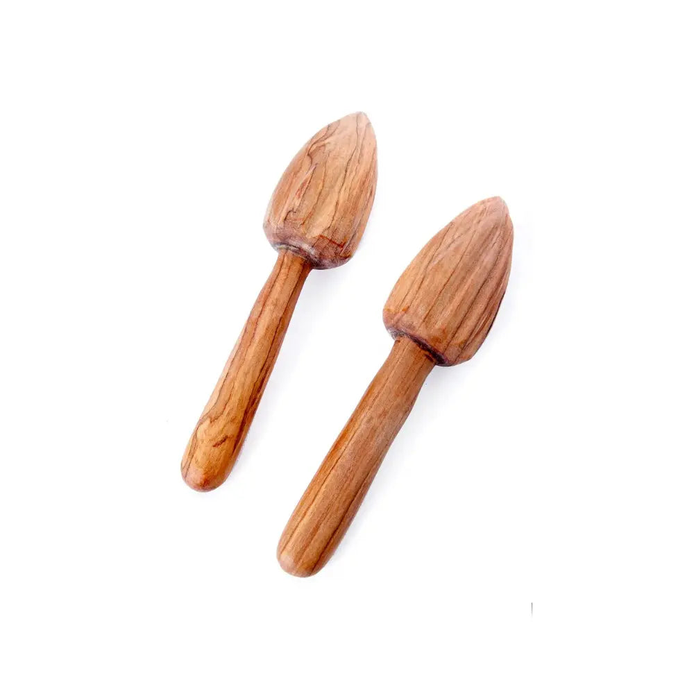 Two wooden citrus juicer tools on a white background
