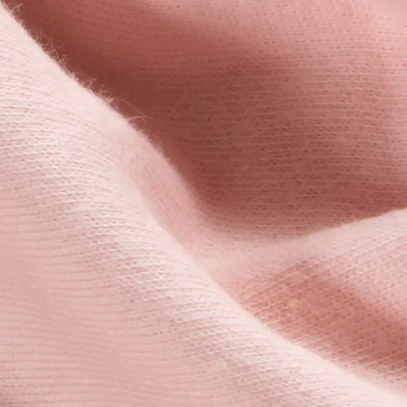 Close-up of peach organic doll making fabric texture