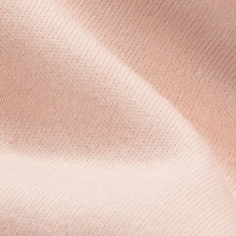 Close-up of salmon organic doll making fabric texture