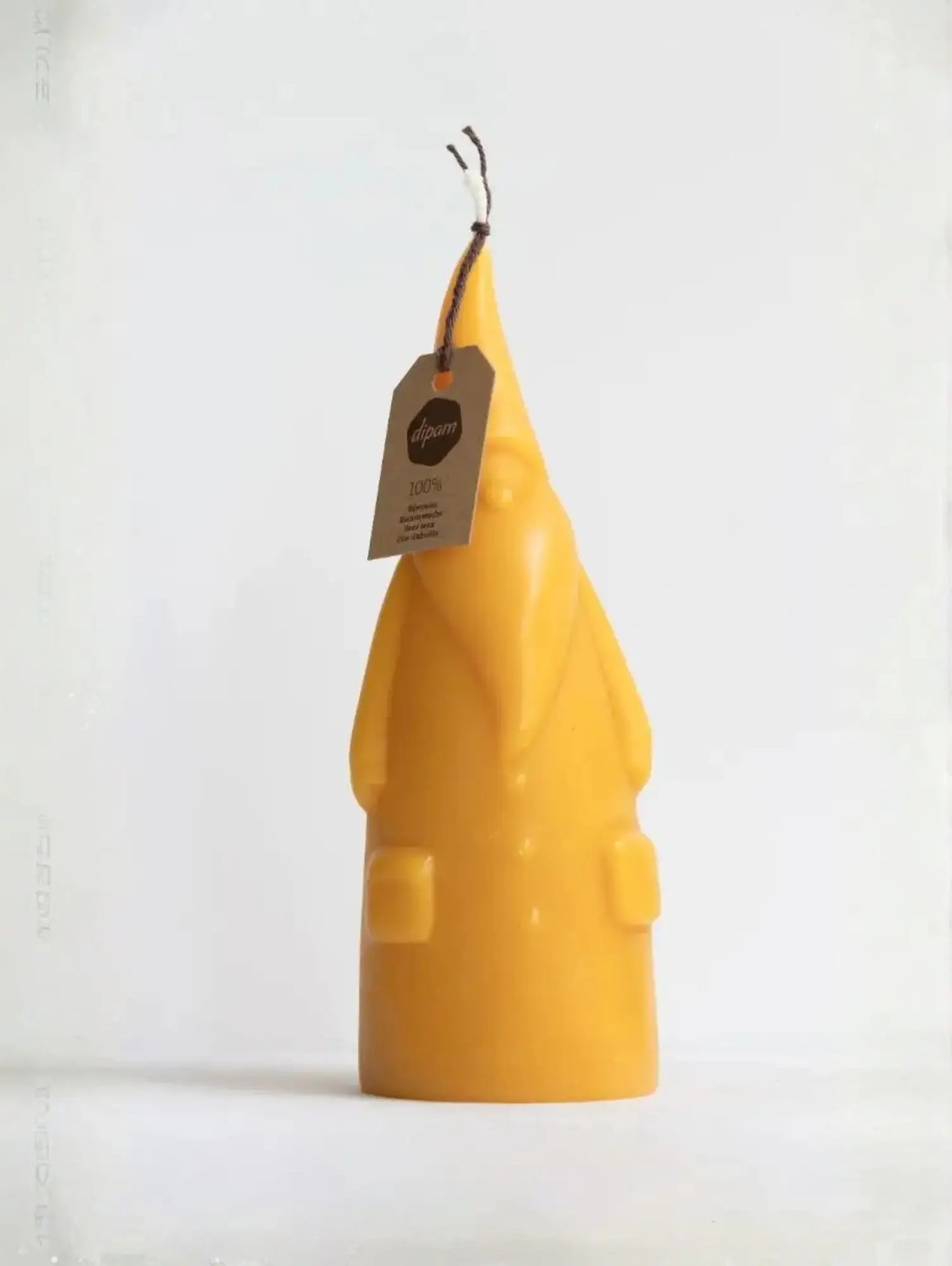 Short Santa Claus Beeswax Candle with a Dipam tag on white background
