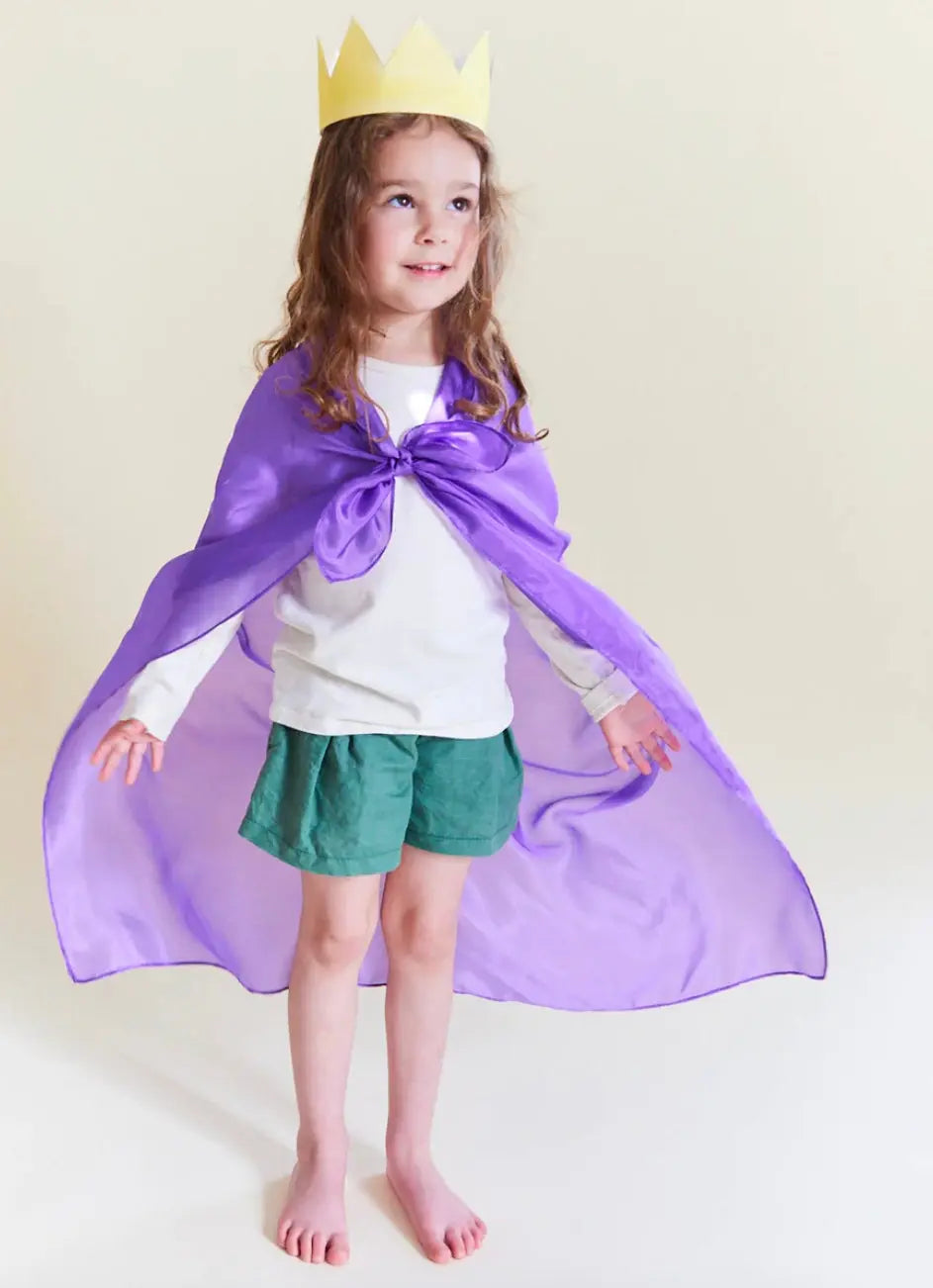 girl wearing a silk crown with a purple playsilk tied on as a cape