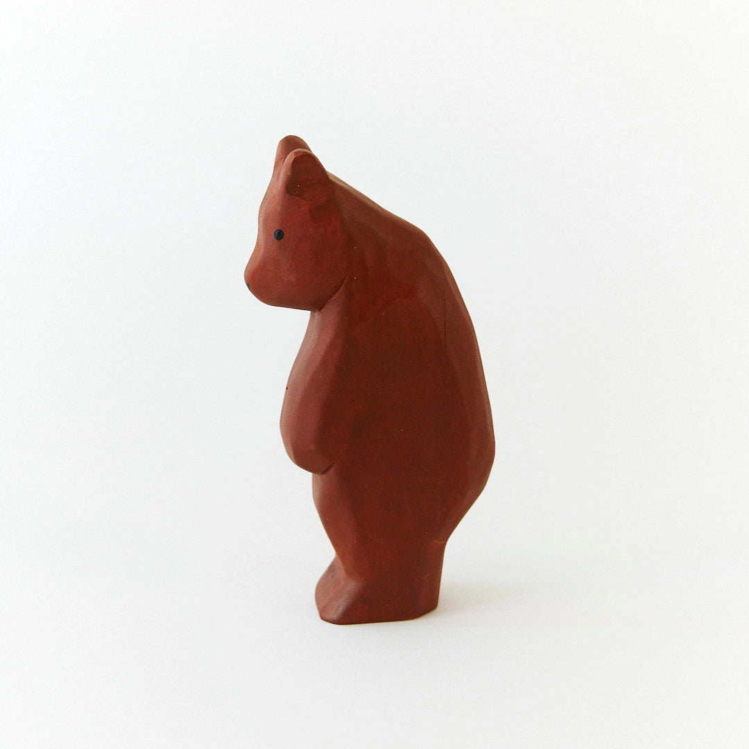 Wooden Brown bear figurine on a white background