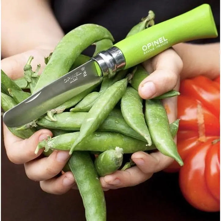 Opinel No. 7 Junior Folding Pocket Knife with garden peans in a child's hands