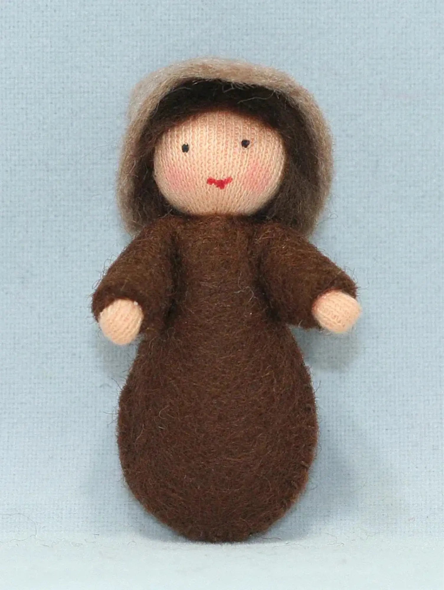 A seed baby light skin tone ambrosia doll for nature tables on a white background