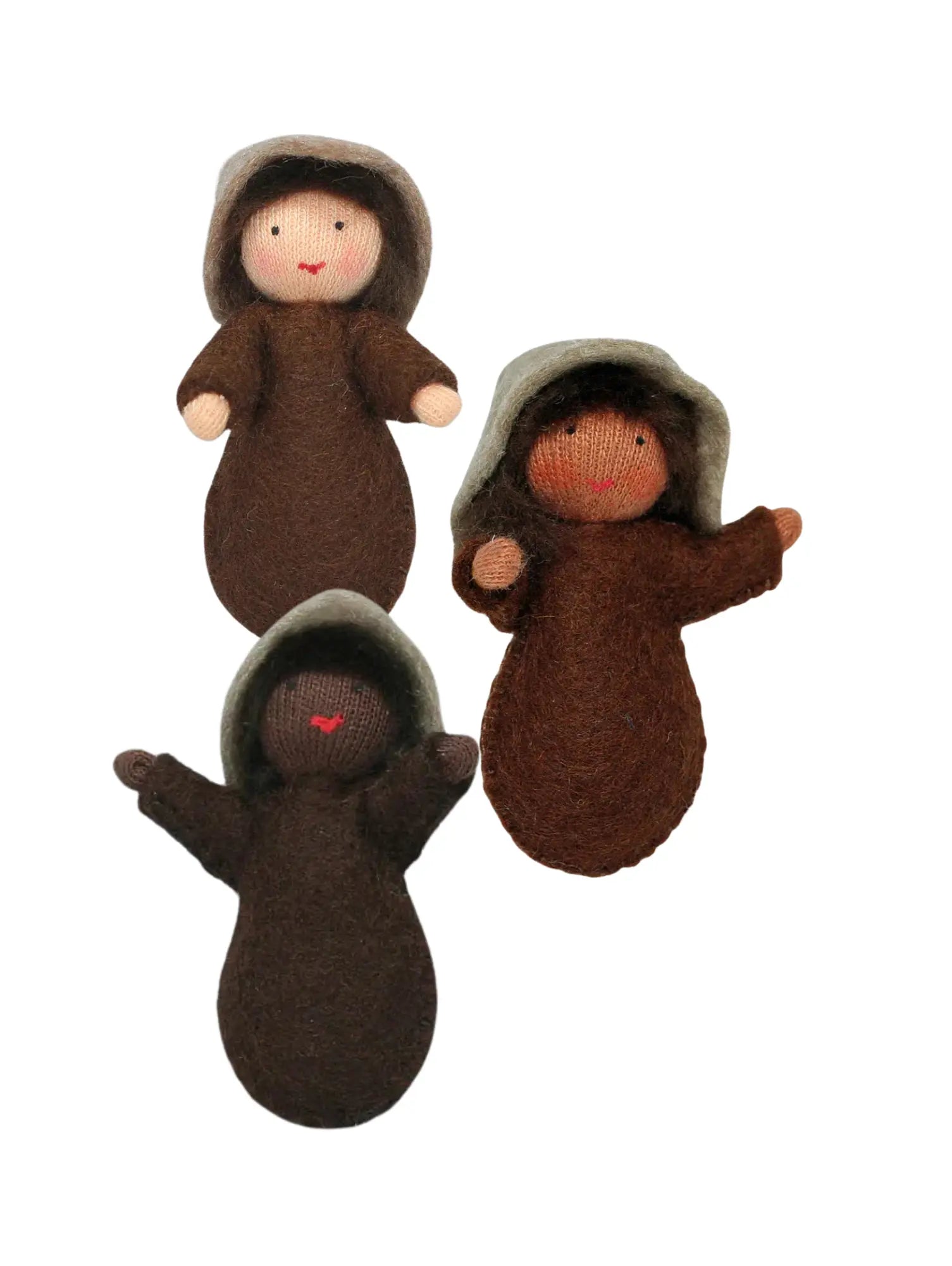 Three brown seed baby dolls on a white background