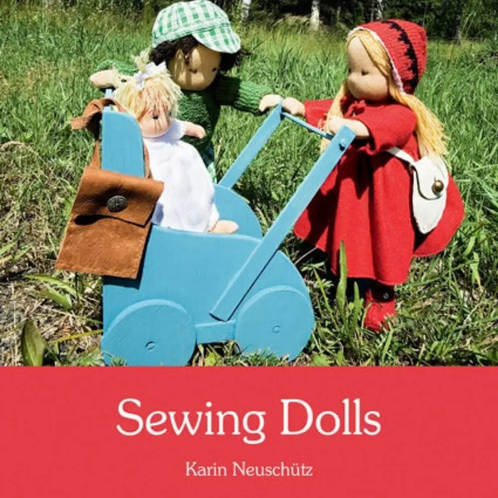 Book cover for Sewing Dolls with a boy and girl doll standing with a wooden doll carriage