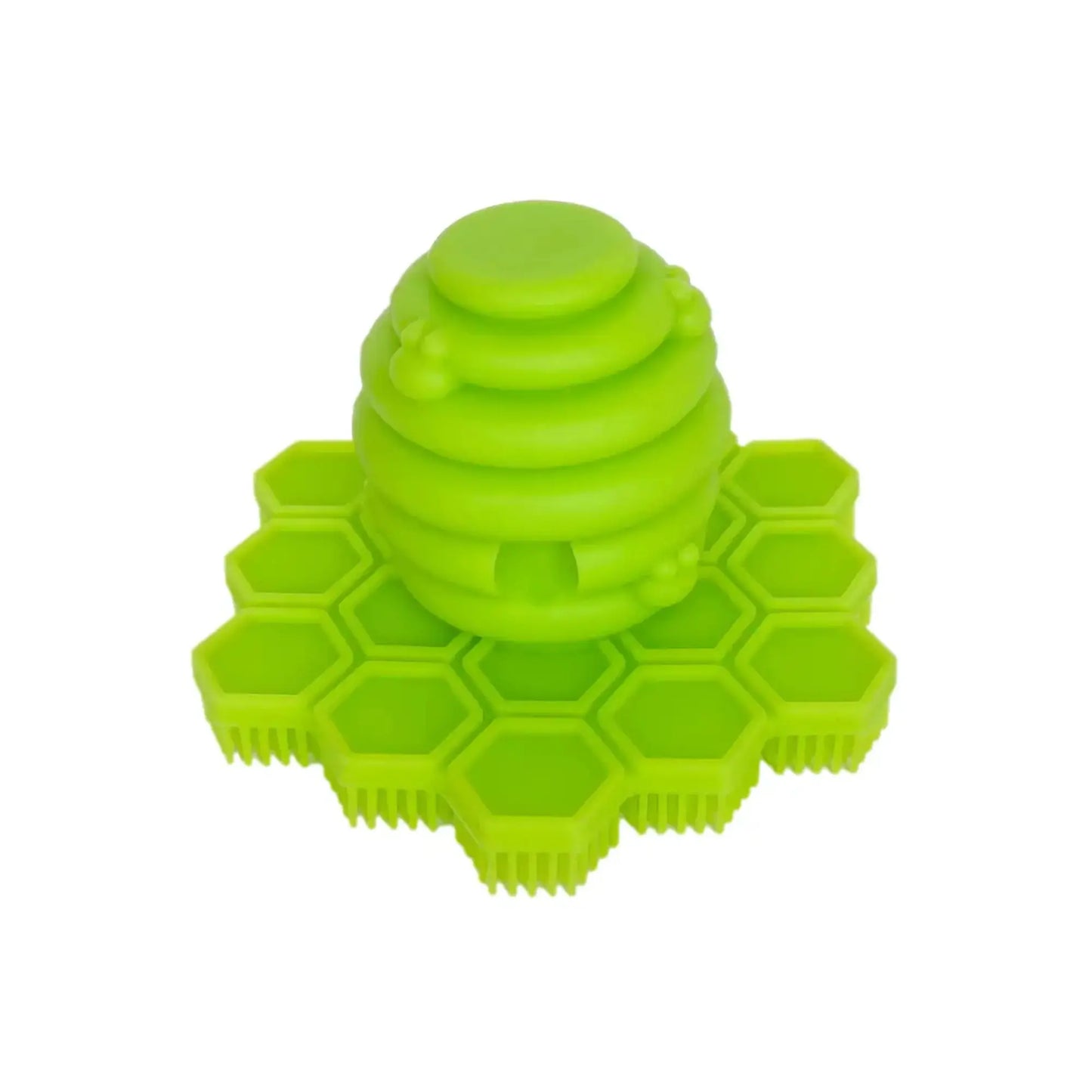 Green honeycomb-shaped silicone Toddler Scrubber on a white background