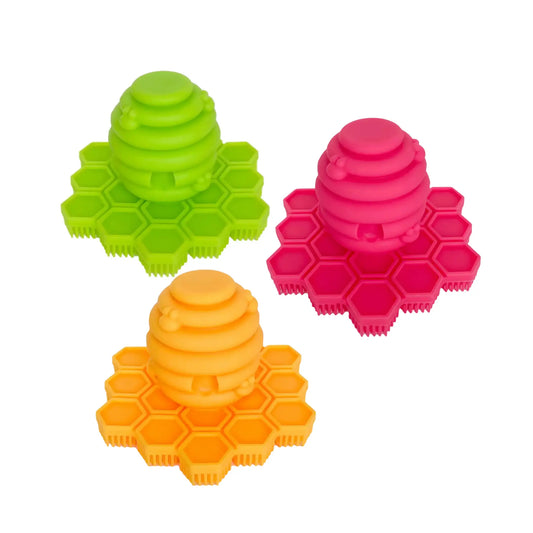 Three colorful silicone srub'bee' for infant scalps and toddler hands, face and feet. 