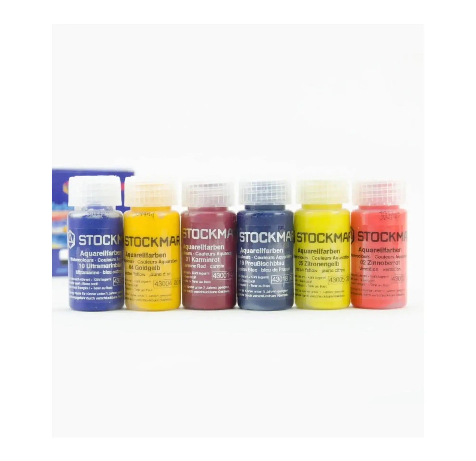 Set of Stockmar watercolor bottles on a white background