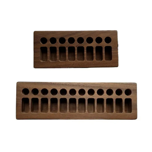 Two rectangular wooden crayon holders for stick and block and crayons on white background