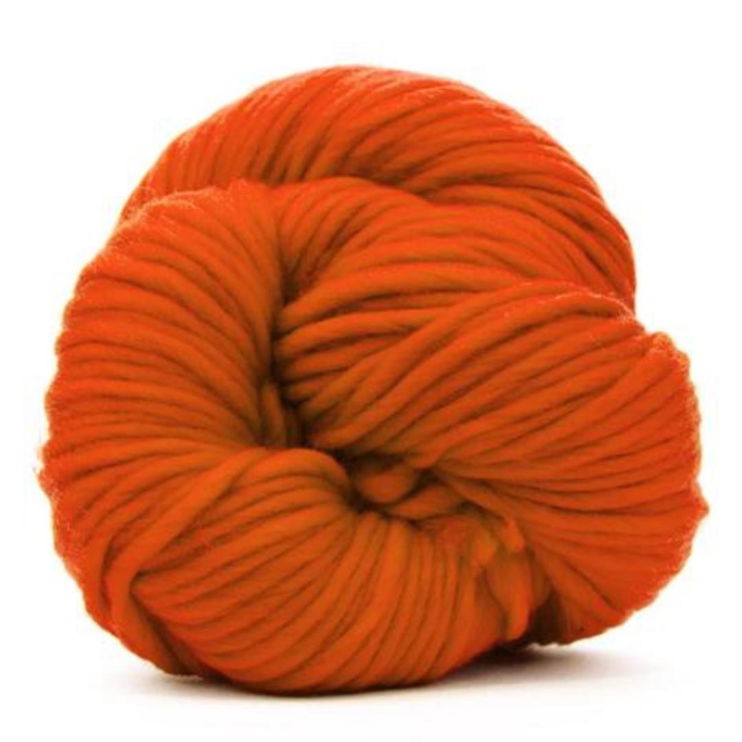 Orange skein of yarn on a white background