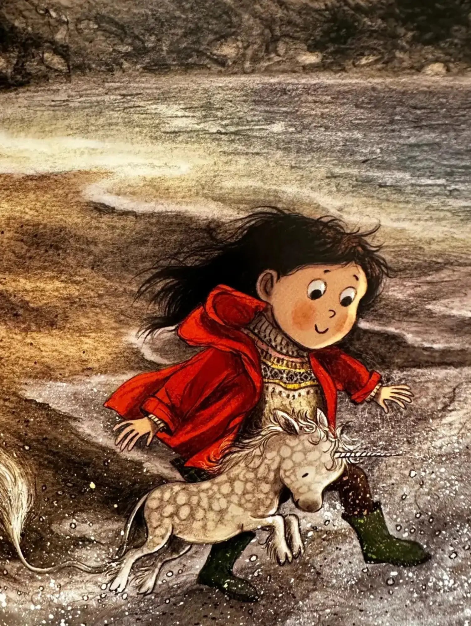 Illustration of a child in a red coat interacting with a unicorn by a body of water.