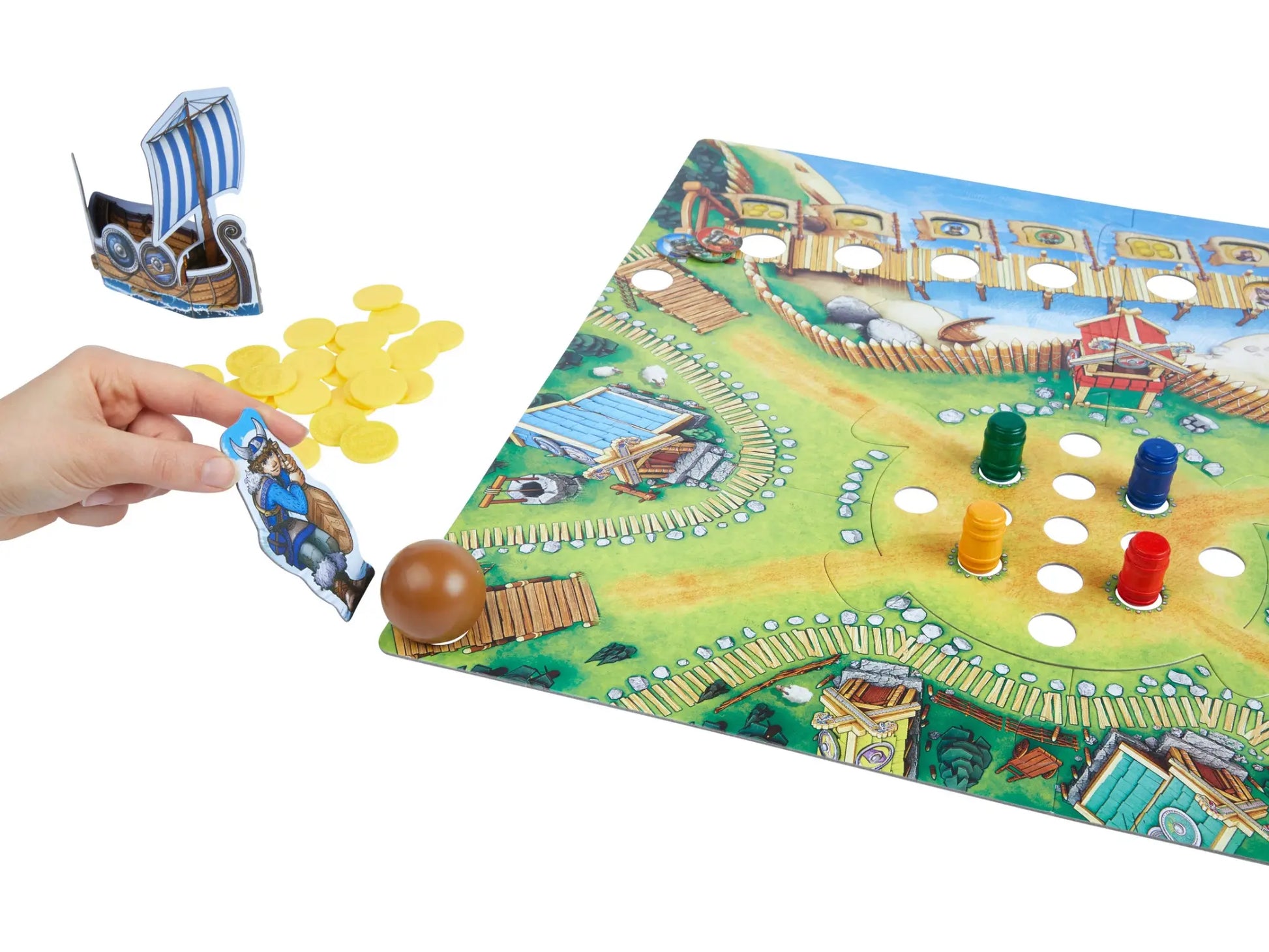 HABA Board game with colorful pieces and a hand interacting with it on a white background
