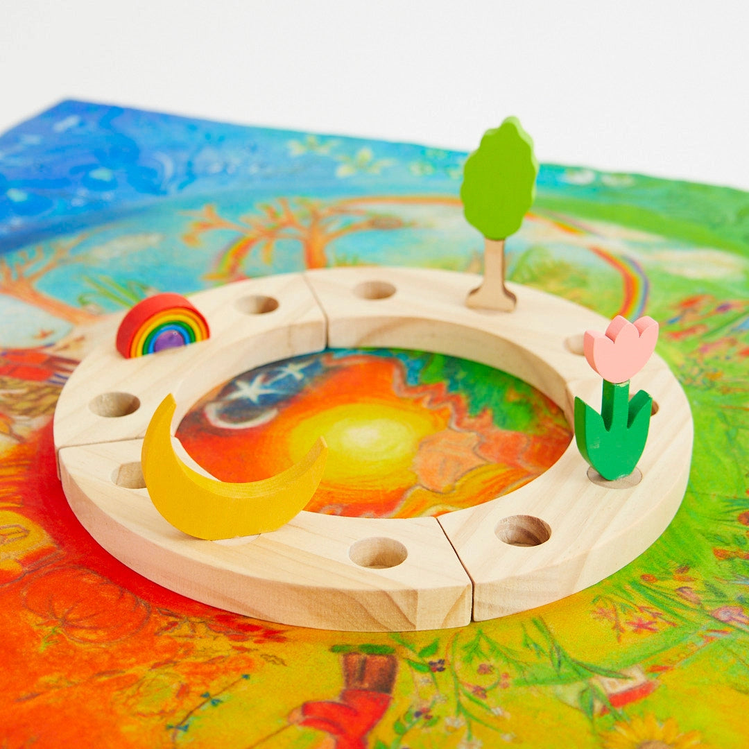 Wooden Waldorf Birthday Ring with colorful elements on a vibrant background