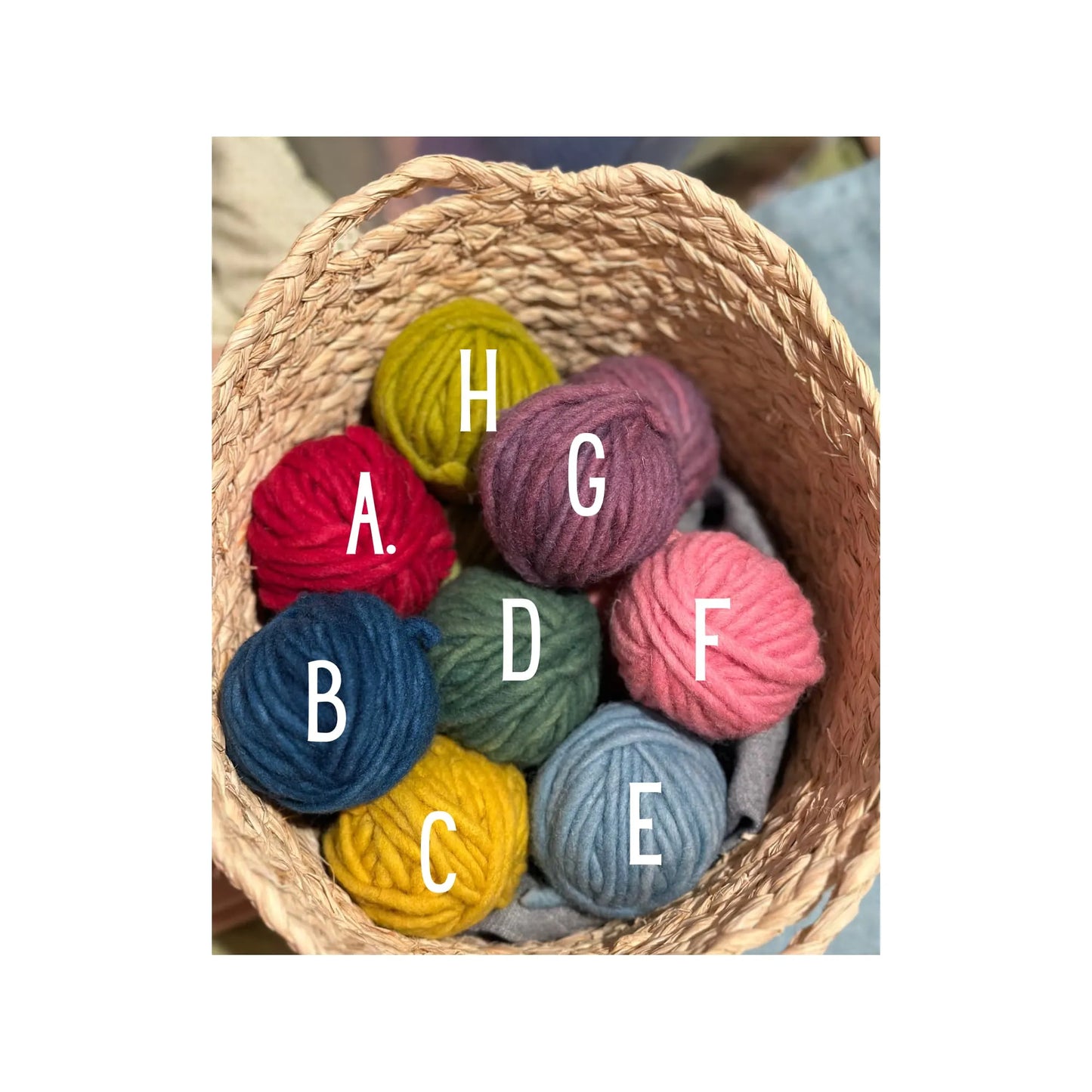 Organic Wool Yarn in a basket with letters on top A - G