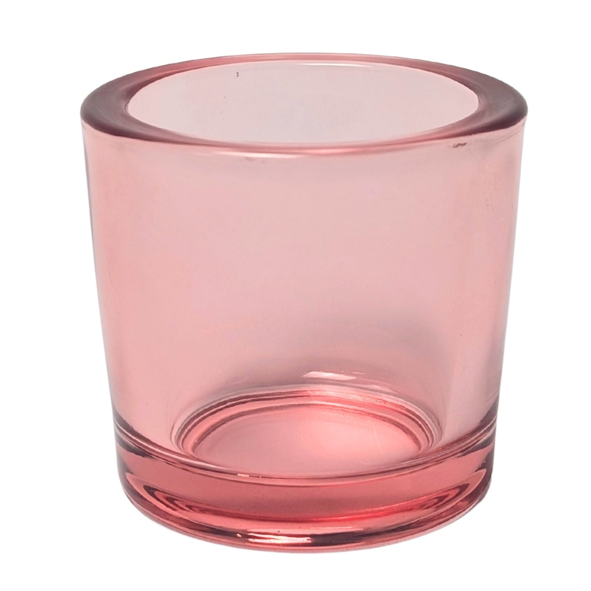Pink glass candle holder on a white background