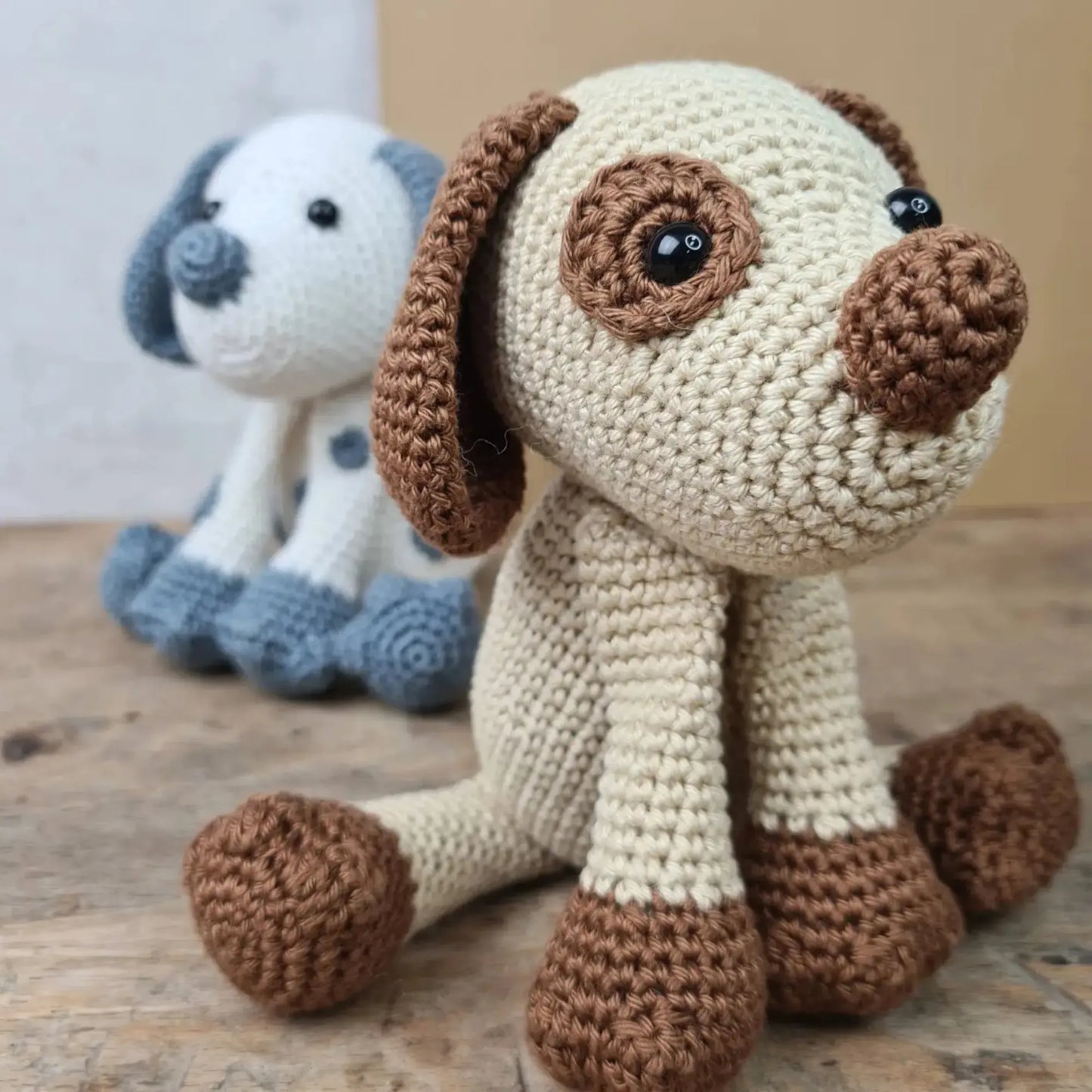 Handmade crocheted puppy soft toy with tan and brown yarn