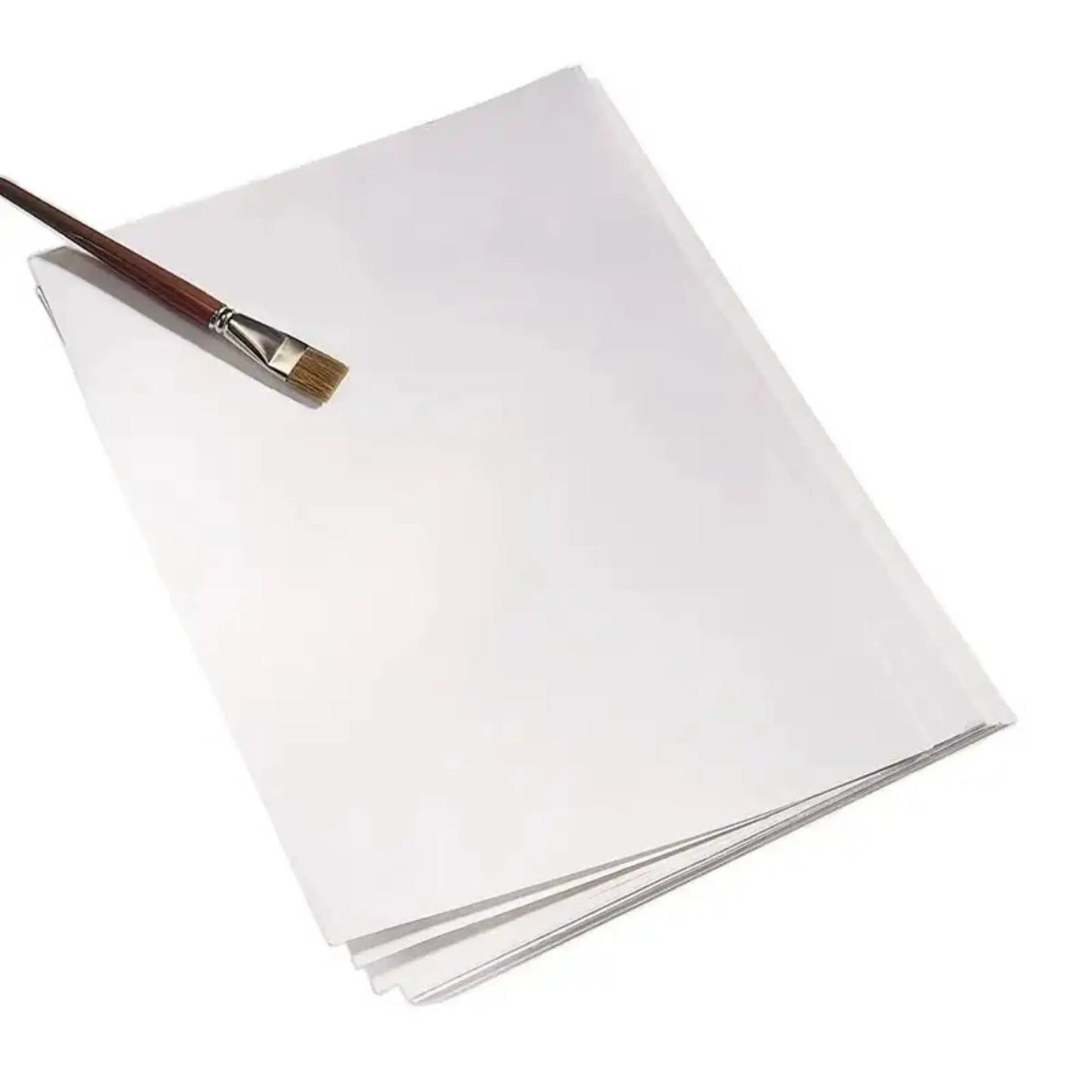 White watercolor paper with a paintbrush on a white background