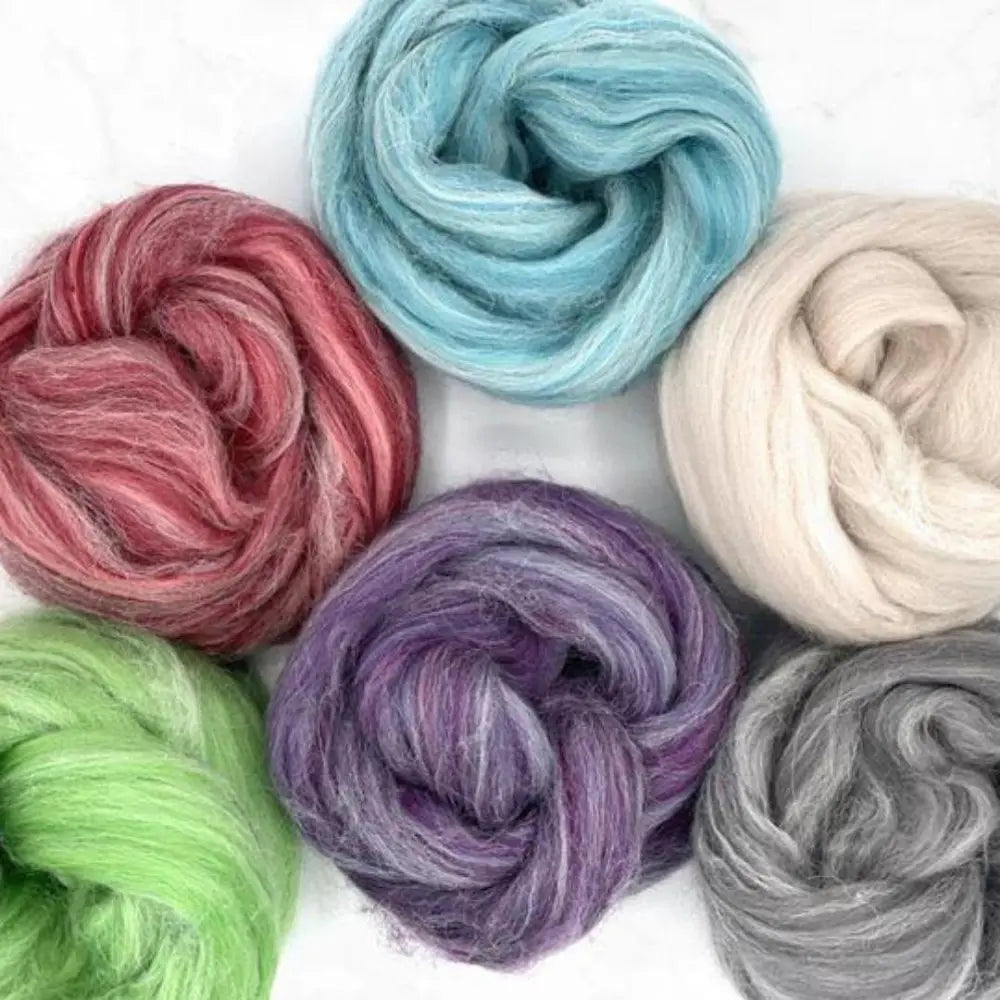 Close-up of Alpaca and merino wool top fiber bundle for spinning and felting on white background