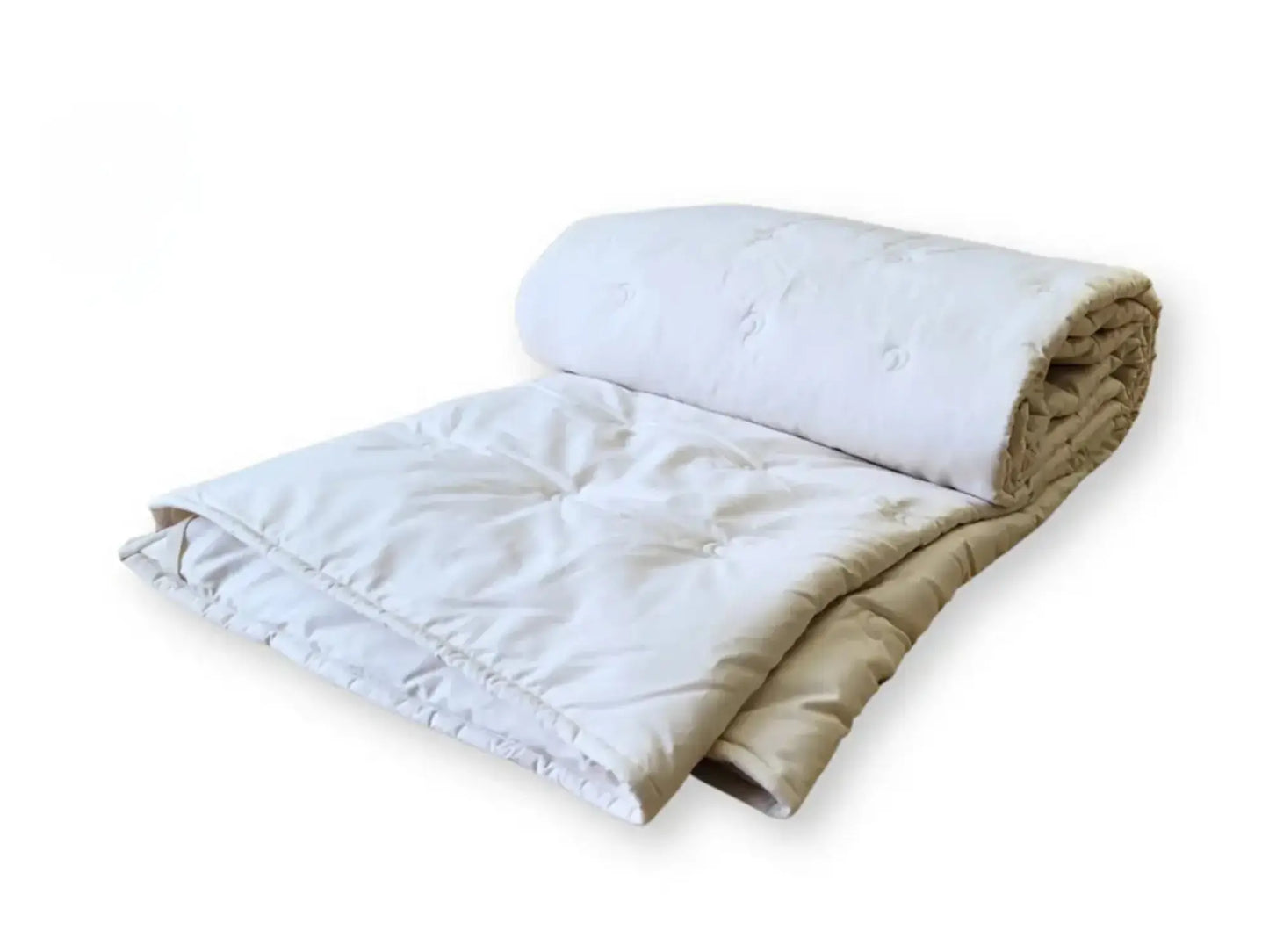 Folded alpaca wool comforter showing layered thickness and soft natural fibers