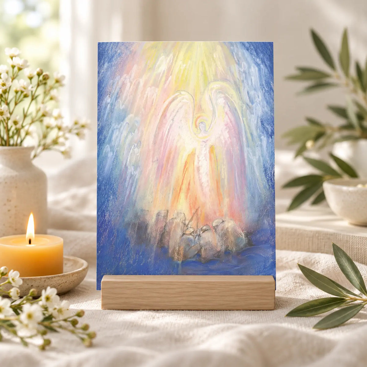 Peace on Earth postcard by Marjan van Zeyl depicing an angel and shepherds in a wooden card stand