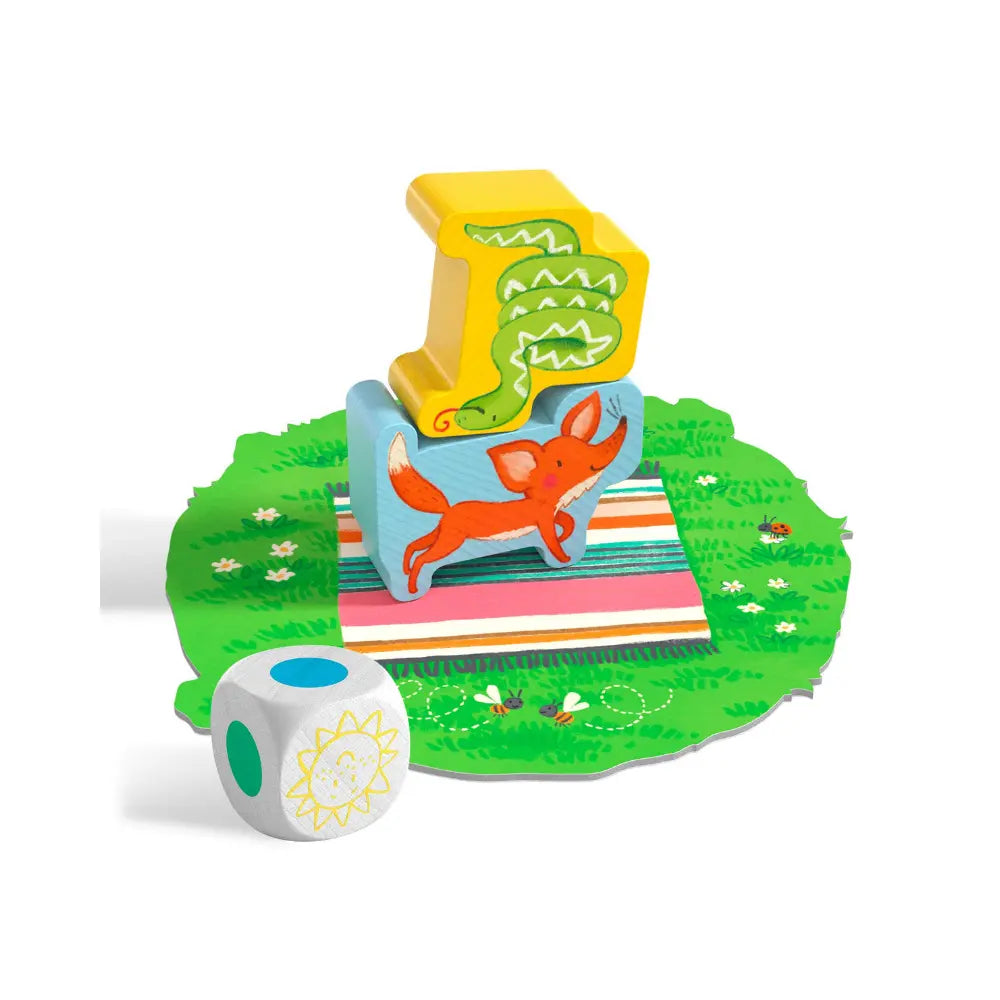 Close-up of wooden animal pieces and die from Animal Upon Animal Junior stacking game