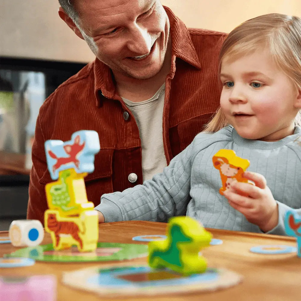 Child and parent playing Animal Upon Animal Junior balance game together