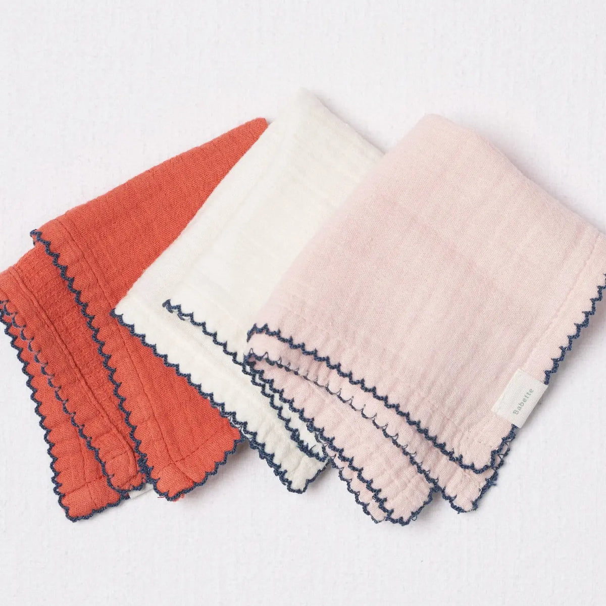 Baby washcloth set in coral, white and pink with navy scalloped trim, made from OEKO-TEX Standard 100 cotton