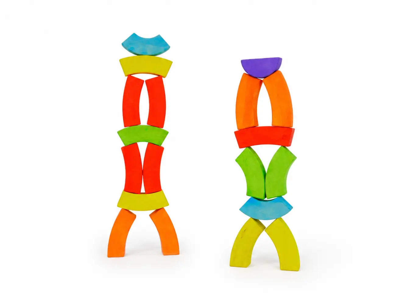 BAJO wooden rainbow blocks balanced into two colorful standing figure sculptures