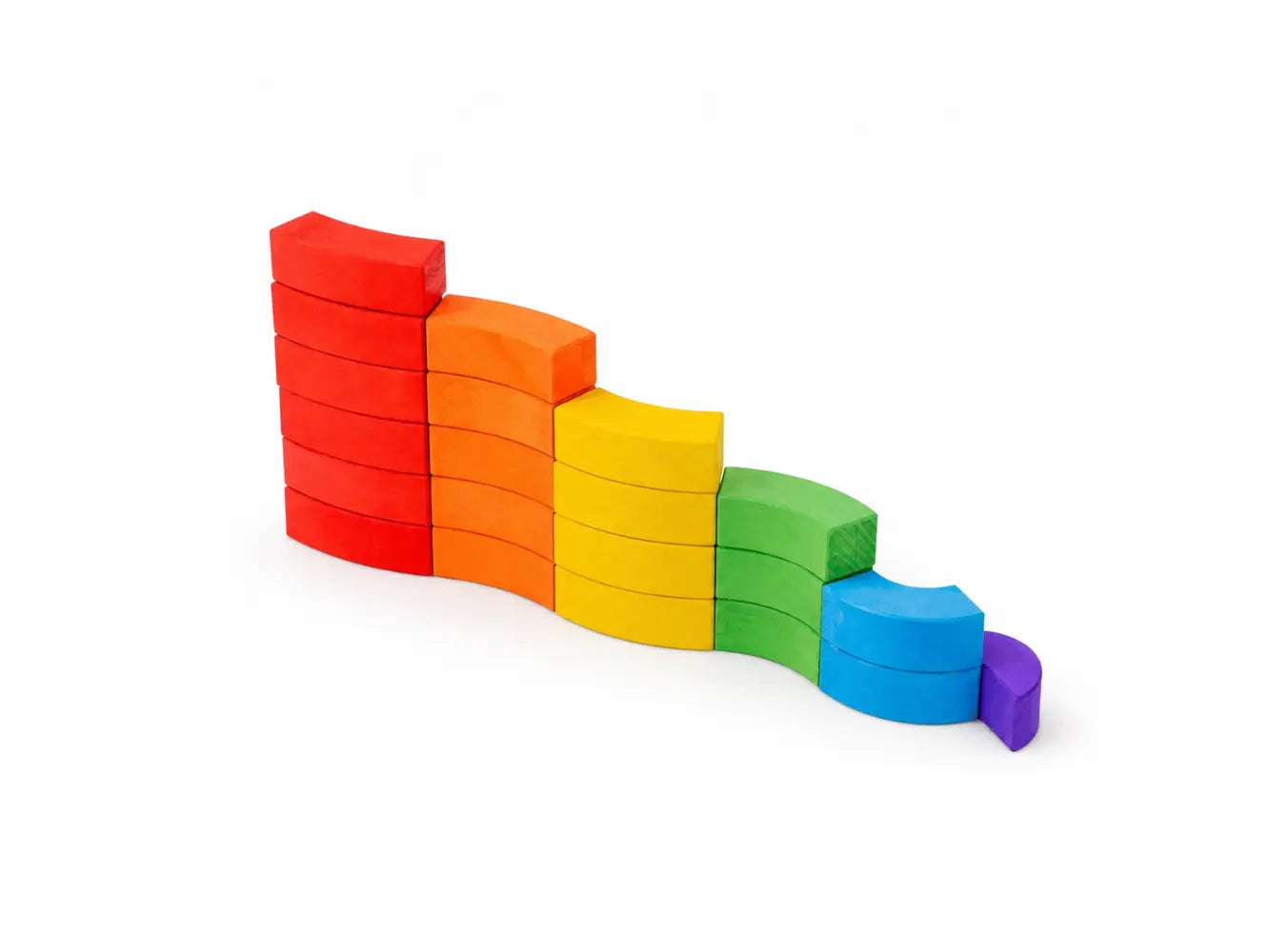 BAJO wooden rainbow blocks arranged into a descending curved wave