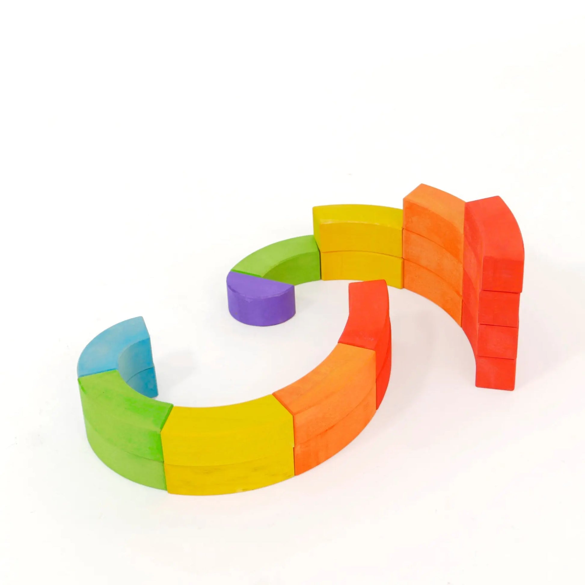 Curved wooden blocks in bright colors on a white background
